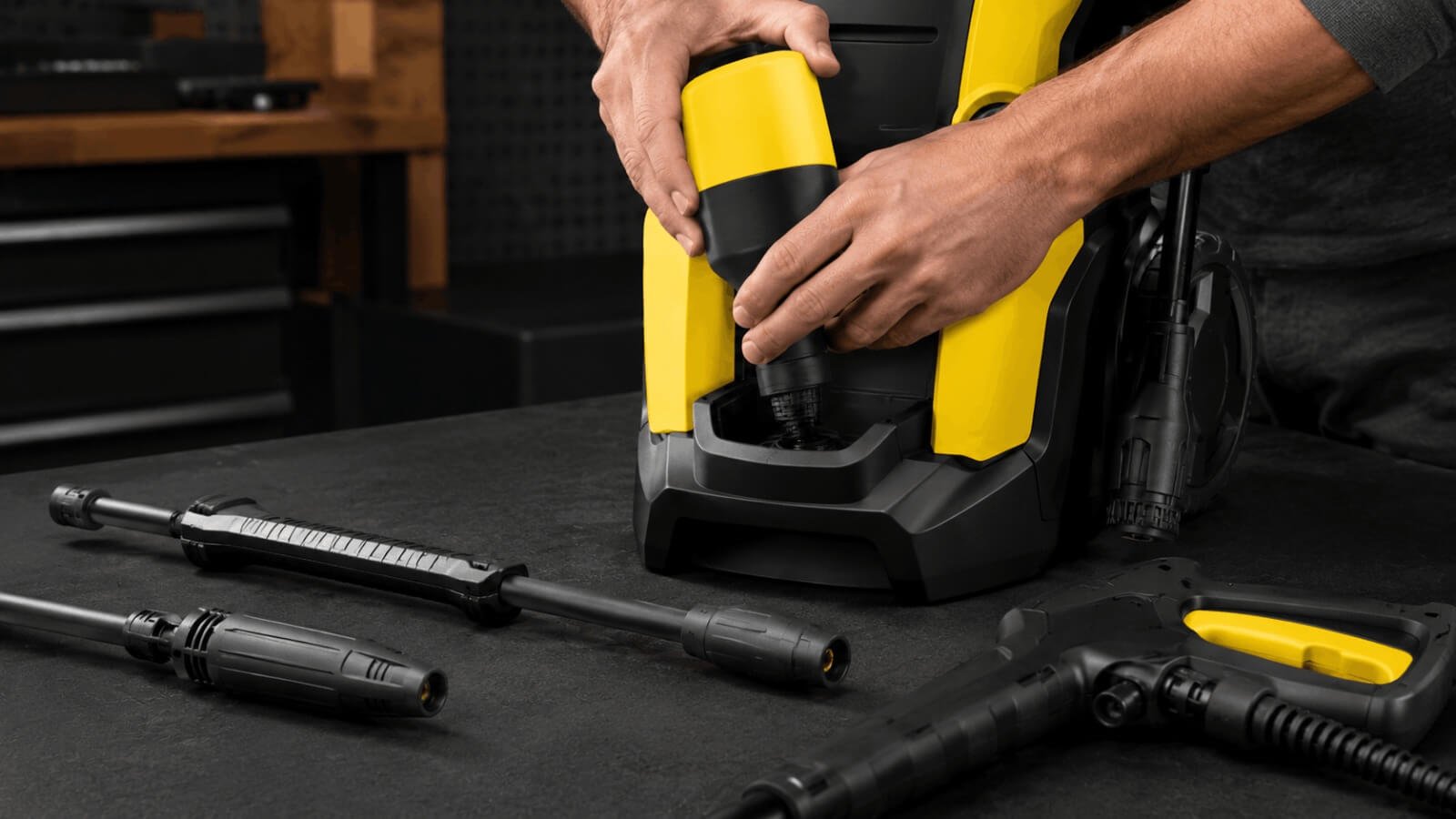 Inserting a detergent bottle into the Karcher K5 Plug and Clean detergent system